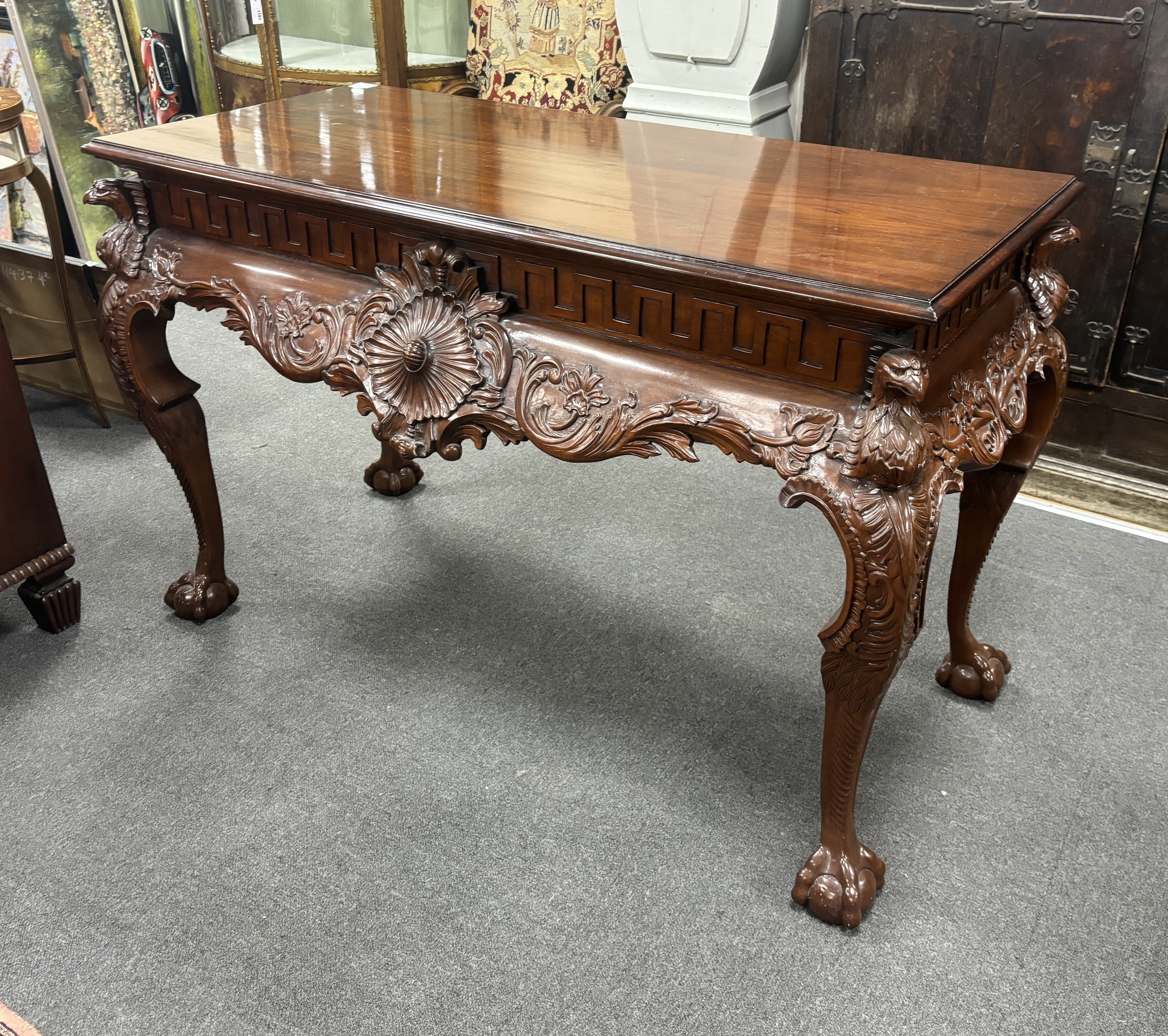 An 18th century style carved mahogany console table, width 136cm, depth 63cm, height 84cm